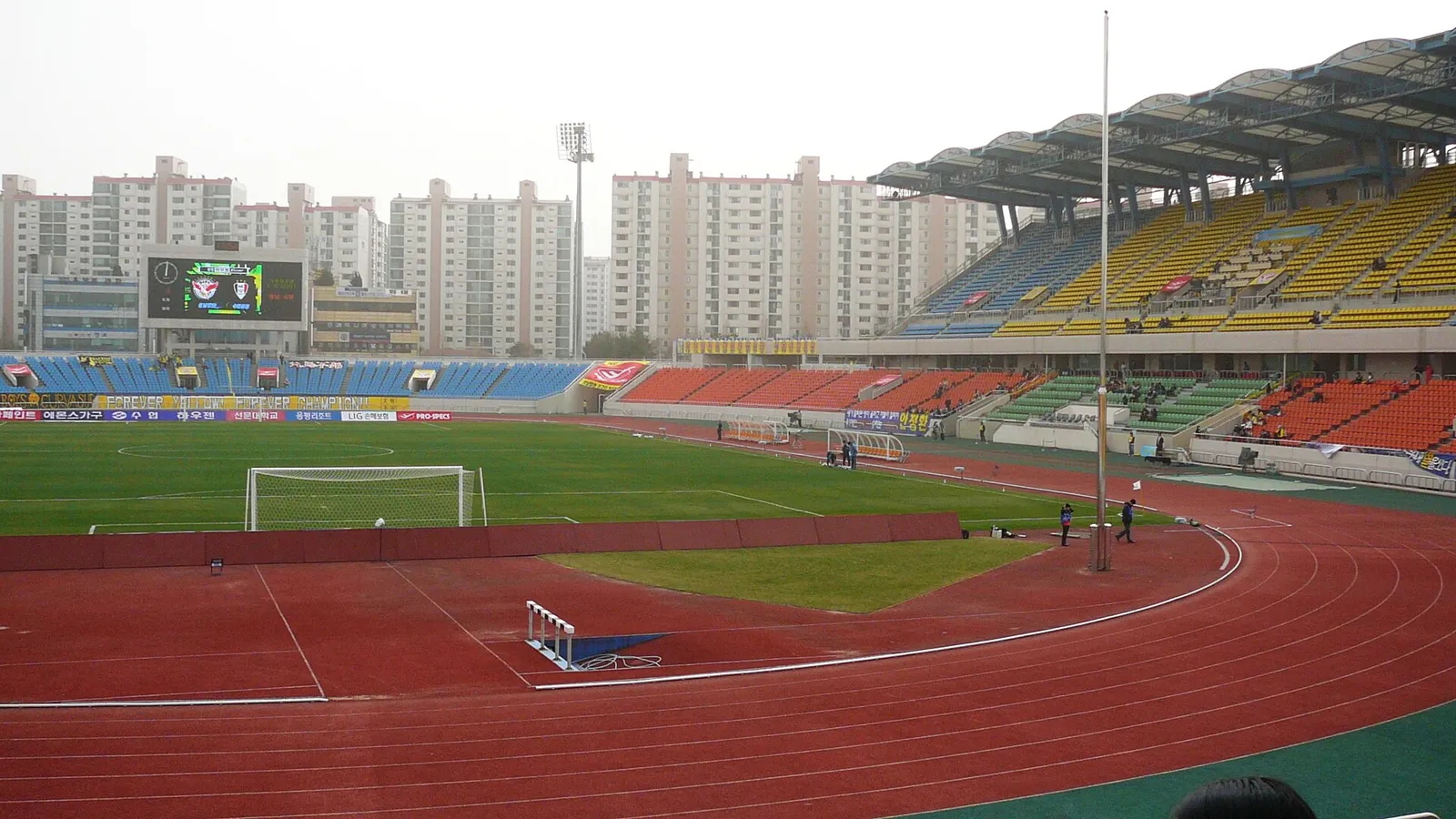 Scoreboard at Tancheon Sports Complex showing the K League 2 Round 29 match time, with a view of the stands